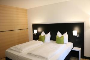 Postel nebo postele na pokoji v ubytování BG Hotel by WMM Hotels