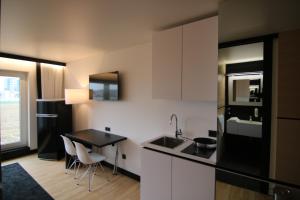 Kuchyň nebo kuchyňský kout v ubytování BG Hotel by WMM Hotels