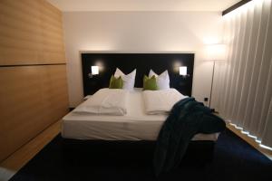 Postel nebo postele na pokoji v ubytování BG Hotel by WMM Hotels