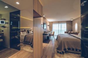 Voodi või voodid majutusasutuse Elizabeth Arthotel Adults Only toas