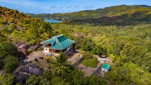an aerial view of a house with a green roof at La Villa Mille Etoiles in Baie Sainte Anne +27 photos