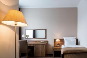 Łóżko lub łóżka w pokoju w obiekcie Hotel Gem
