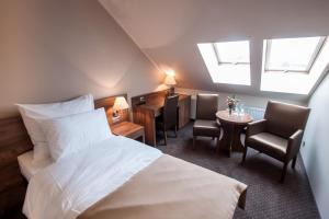 Łóżko lub łóżka w pokoju w obiekcie Hotel Gem
