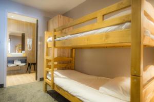 Двухъярусная кровать или двухъярусные кровати в номере SOWELL Family Valfrejus