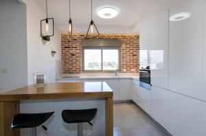 Kuchyň nebo kuchyňský kout v ubytování Maorissimo Boutique Apartment