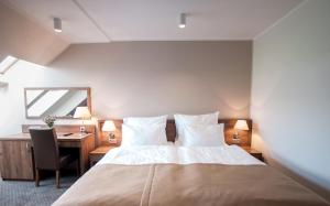 Łóżko lub łóżka w pokoju w obiekcie Hotel Gem