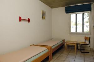 Ein Bett oder Betten in einem Zimmer der Unterkunft Sion Youth Hostel