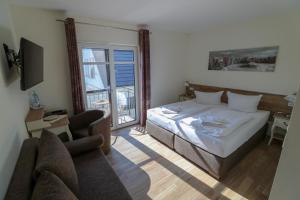 Postel nebo postele na pokoji v ubytování Usedom Bike Hotel & Suites + 37 fotografií