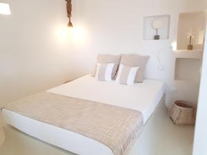 Un pat sau paturi într-o cameră la Casa Mirella