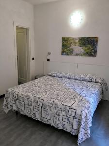 Postel nebo postele na pokoji v ubytování Albergo Al Carugio