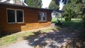 a log cabin with a window on the side of it at Ferienhaus Congolo in Lontzen +5 photos