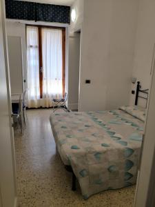 Postel nebo postele na pokoji v ubytování Albergo Al Carugio