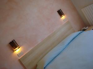 A bed or beds in a room at Hotel Villa Rita