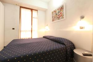 Postel nebo postele na pokoji v ubytování Albergo Al Carugio