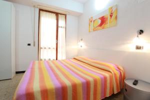 Postel nebo postele na pokoji v ubytování Albergo Al Carugio