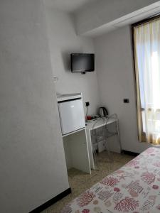 TV a/nebo společenská místnost v ubytování Albergo Al Carugio