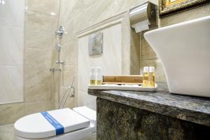 Koupelna v ubytování Hotel ARJUNAA