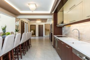 A kitchen or kitchenette at Ino Villa, Unique Group Gatherings, By ThinkVilla