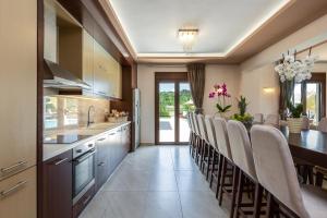 A kitchen or kitchenette at Ino Villa, Unique Group Gatherings, By ThinkVilla