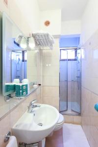 a bathroom with a sink, toilet and shower at Albergo Al Carugio in Monterosso al Mare