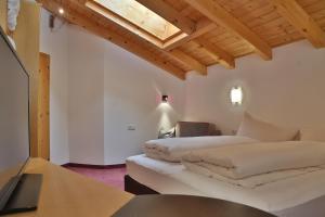 Posteľ alebo postele v izbe v ubytovaní Alp Larain B&B + 37 fotografií