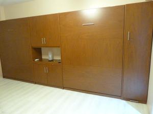 a row of wooden cabinets in a room at Esmeralda y Tucumán in Buenos Aires