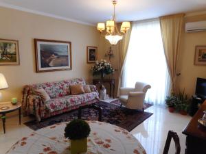 a living room with a couch and a table at adalgisa house in Catania