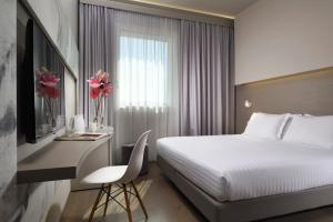 Postel nebo postele na pokoji v ubytování Hotel Glance In Florence