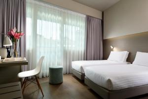 Postel nebo postele na pokoji v ubytování Hotel Glance In Florence