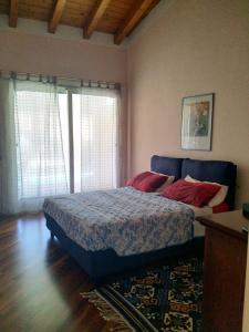 Postel nebo postele na pokoji v ubytování Appartamento in Residenza dei Limoni