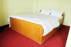 Rúm í herbergi á Gorgeous Village Guest House
