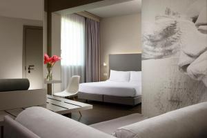 Postel nebo postele na pokoji v ubytování Hotel Glance In Florence + 37 fotografií