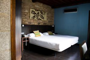Posteľ alebo postele v izbe v ubytovaní Hotel A Tafona do Peregrino