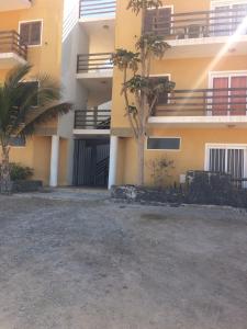 an empty parking lot in front of a building at Casa Boteto 2 Bedroom Ground Floor Apartment in Sal Rei