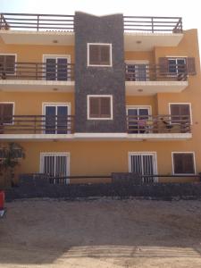a building with balconies on the side of it at Casa Boteto 2 Bedroom Ground Floor Apartment in Sal Rei