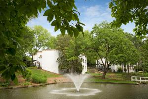 a fountain in a pond in a park at Griffin Hotel, an official Colonial Williamsburg Hotel in Williamsburg