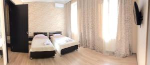 Postelja oz. postelje v sobi nastanitve Guest House Kakheti