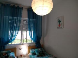 Posteľ alebo postele v izbe v ubytovaní Apartament Naranja con piscina urb El Paraiso