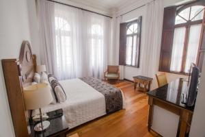 Letto o letti in una camera di Johnscher by SJ - San Juan Curitiba