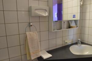 Koupelna v ubytování Hotel Garni Rösslipost