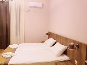 Postel nebo postele na pokoji v ubytování Hotel Classic