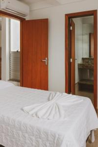 Star Apart Hotel tesisinde bir odada yatak veya yataklar