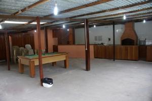 a room with a ping pong table in it at Pousada Recanto das Flores in Nova Friburgo