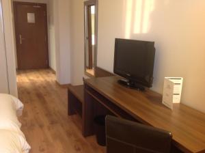TV a/nebo společenská místnost v ubytování Hotel Pago del Olivo