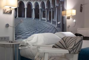 Postel nebo postele na pokoji v ubytování AACR Hotel Monteolivos
