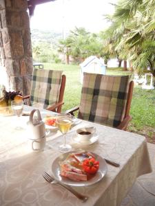 a table with a plate of food on top of it at Villa Laurea in Lovran +33 photos
