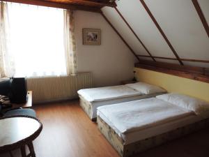 Postel nebo postele na pokoji v ubytování Penzion Pohoda Beroun