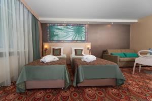 Postel nebo postele na pokoji v ubytování Hotel Klimczok Resort&Spa