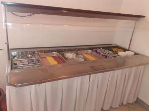 a refrigerator filled with lots of different types of food at Pansion Comfort Sidro in Novalja