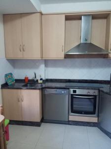 A kitchen or kitchenette at EL RINCON DE LUZ